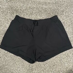 Black ZYIA summer shorts. Medium. One small imperfection shown in photo.